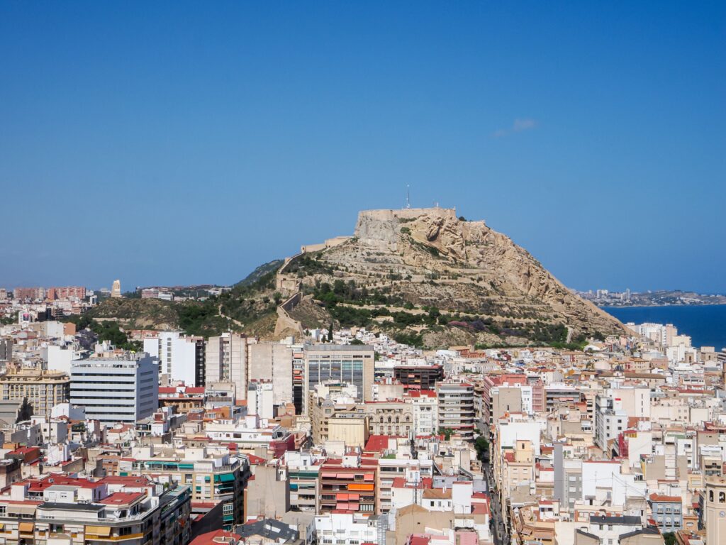 Things to do in Alicante, panoramic view of Santa Bárbara Castle and the Mediterranean coast.